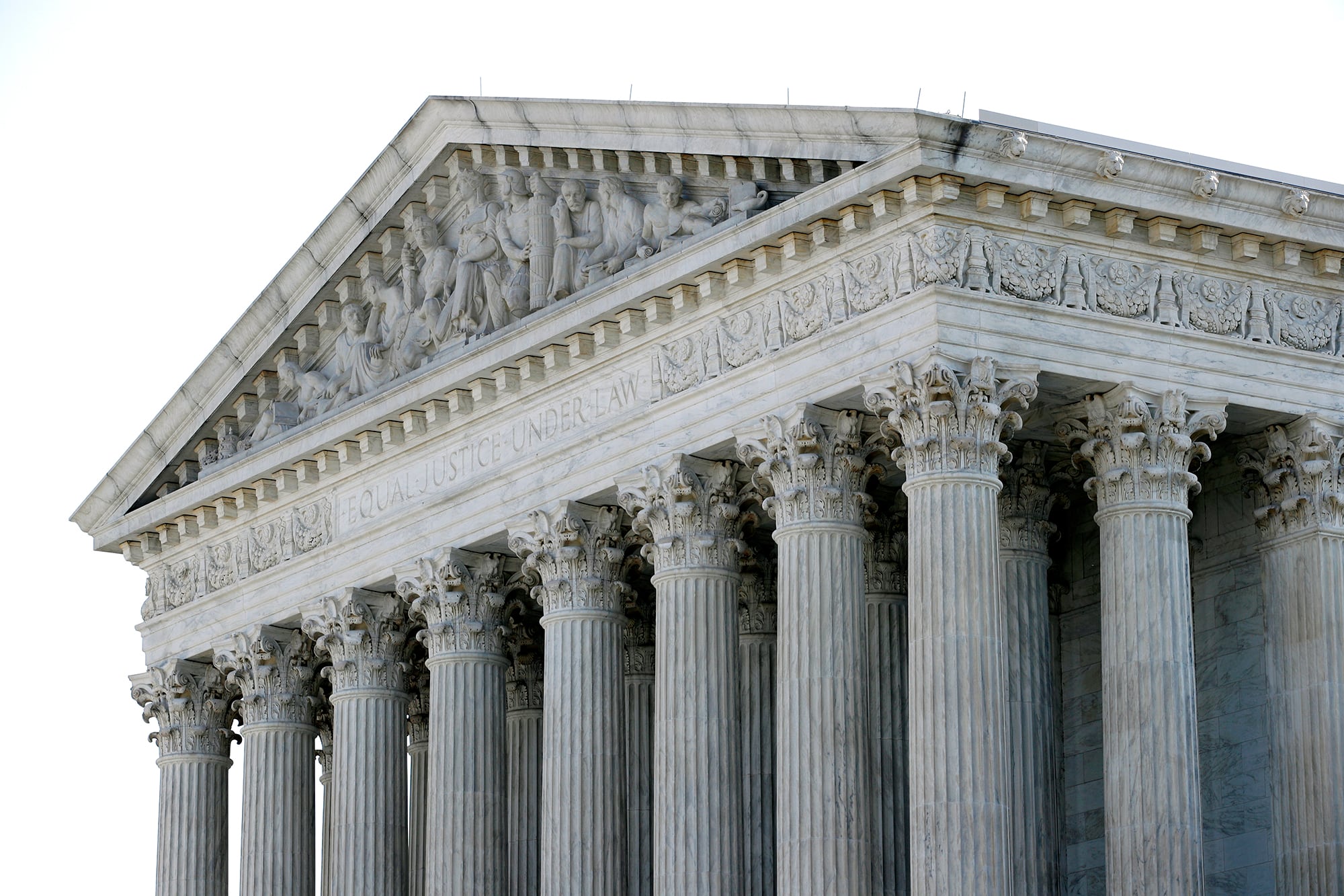 The sun rises behind the Supreme Court on Capitol Hill in Washington, Monday, June 29, 2020.