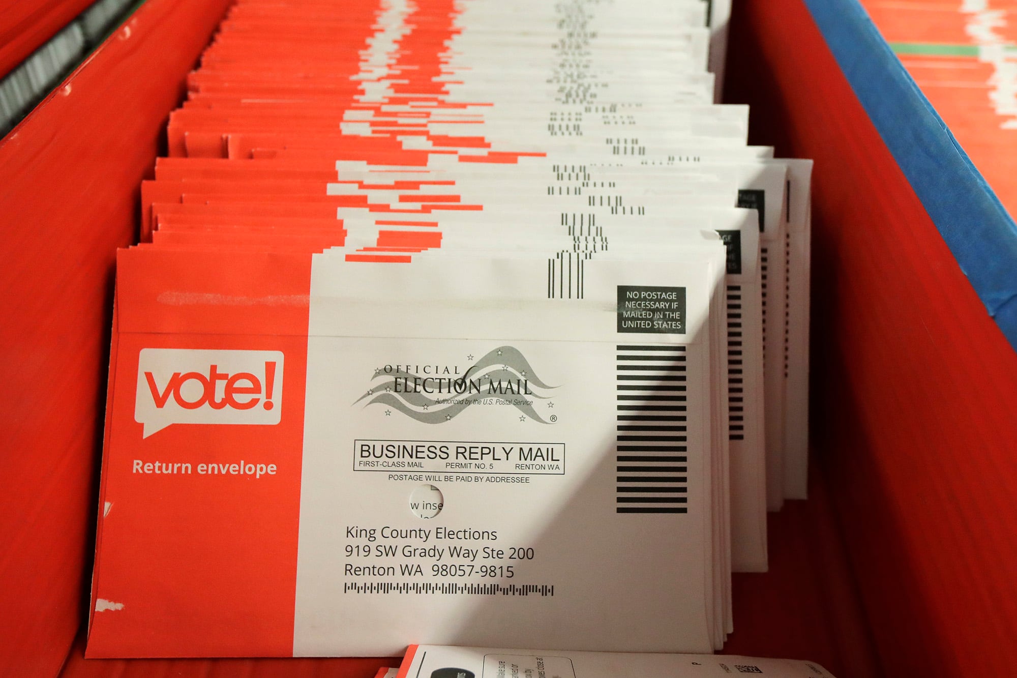 Vote-by-mail ballots are shown in a sorting tray on Aug. 5, 2020, at the King County Elections headquarters in Renton, Wash., south of Seattle.