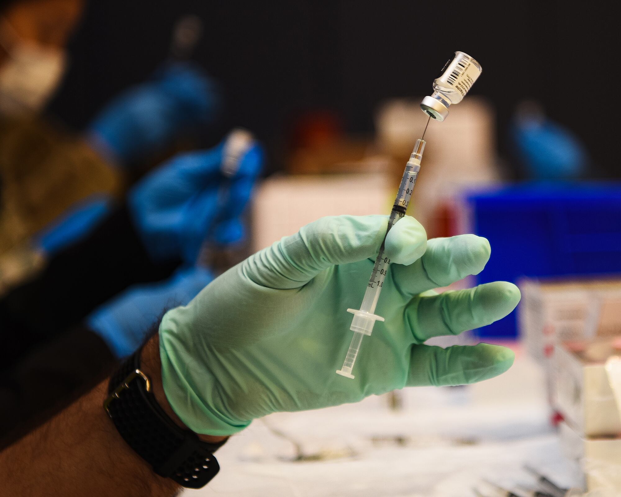 Air Force Lt. Col. Roy Loque, 17th Operational Medical Readiness Squadron commander, readies a COVID-19 vaccination at the Mathis Fitness Center on Goodfellow Air Force Base, Texas, Jan. 20, 2021.